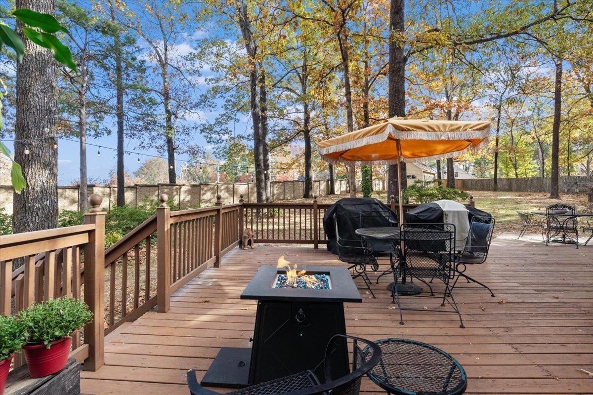 732 North Tree Drive Collierville, TN 38017 - Photo 36 of 40 Wooden deck featuring an outdoor fire pit, a fenced backyard, outdoor dining area, and a grill