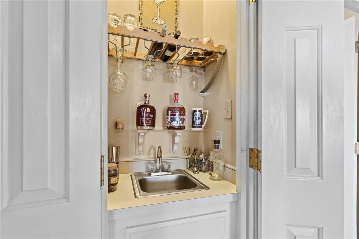732 North Tree Drive Collierville, TN 38017 - Photo 10 of 40 Indoor wet bar featuring light countertops