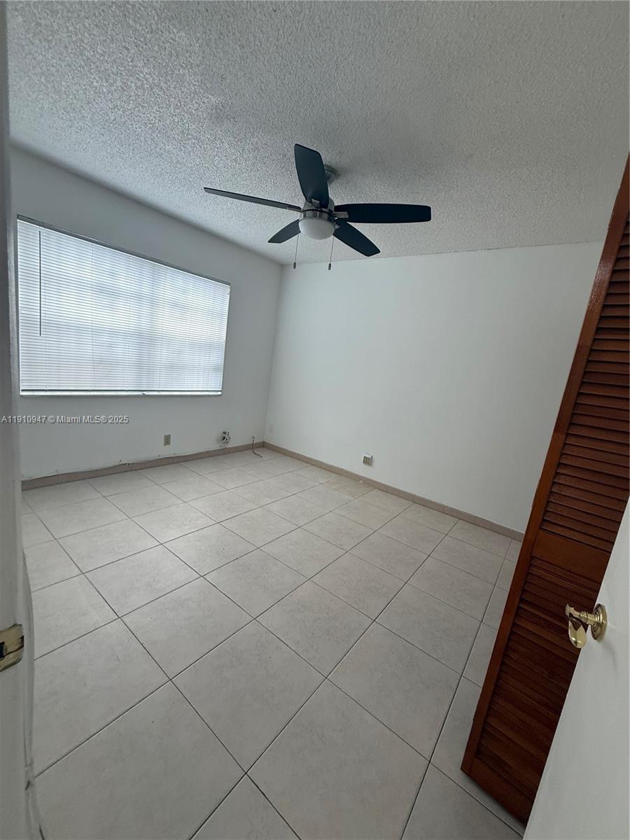 12810 Southwest 43rd Drive, Unit 115B Miami, FL 33175 - Photo 11 of 22 a view of an empty room
