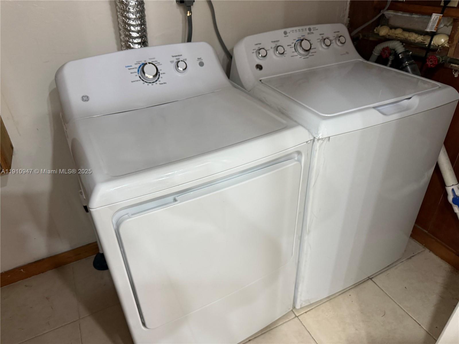 12810 Southwest 43rd Drive, Unit 115B Miami, FL 33175 - Photo 22 of 22 a close up of a utility room with dryer and washer