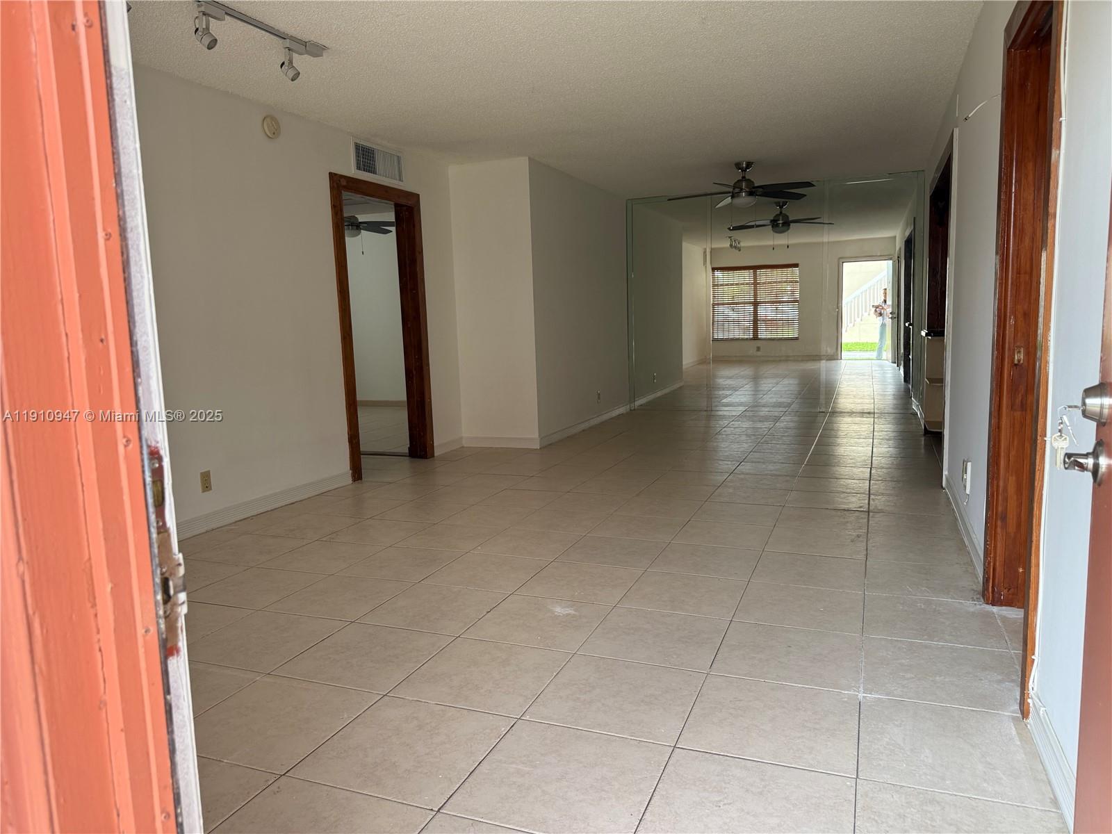 12810 Southwest 43rd Drive, Unit 115B Miami, FL 33175 - Photo 6 of 22 a view of hallway with livingroom