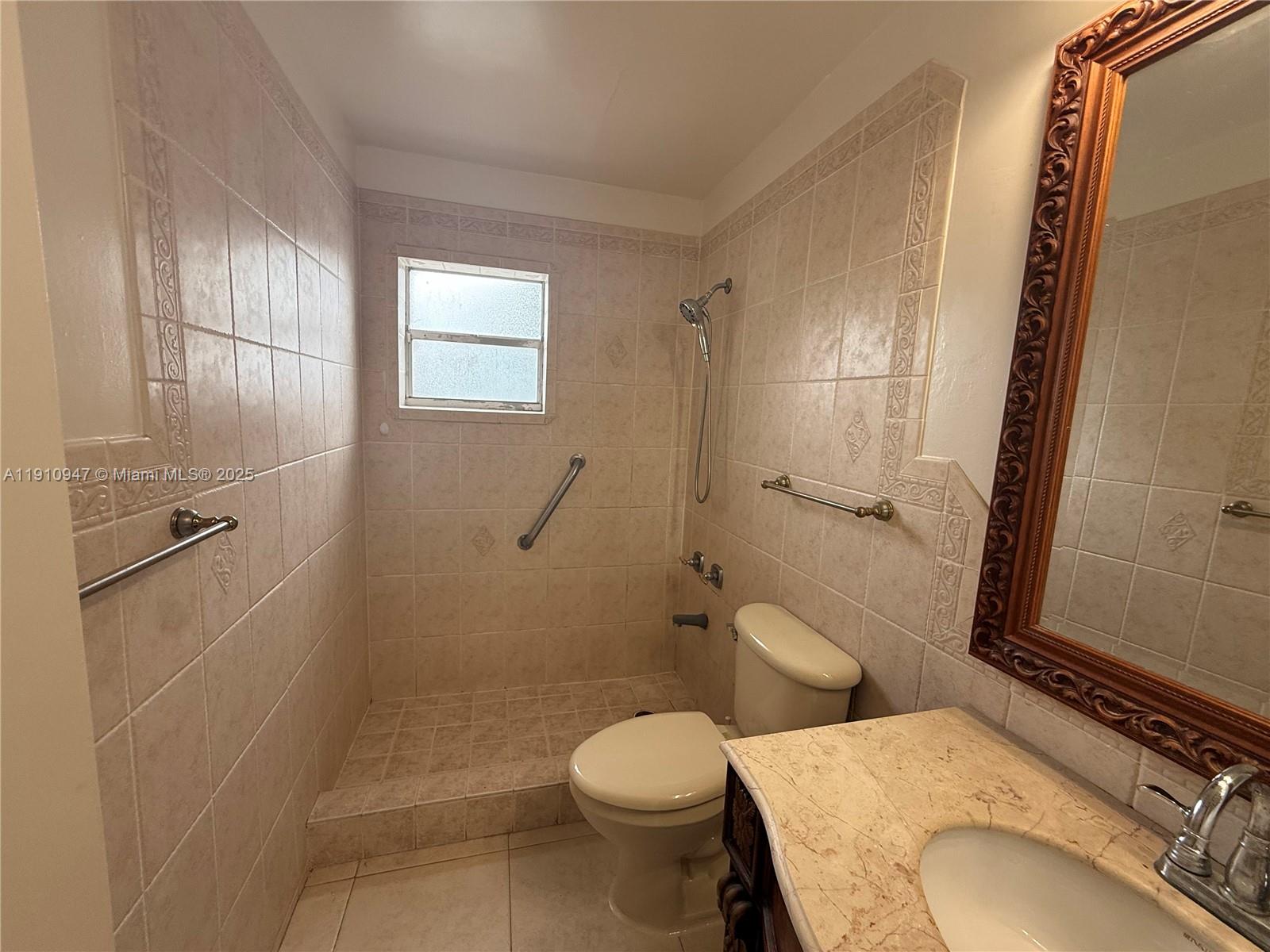 12810 Southwest 43rd Drive, Unit 115B Miami, FL 33175 - Photo 7 of 22 a bathroom with a toilet sink and shower