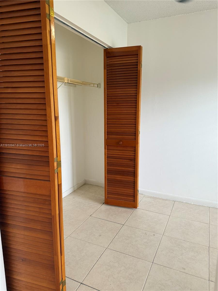 12810 Southwest 43rd Drive, Unit 115B Miami, FL 33175 - Photo 10 of 22 a view of entryway with a white walls