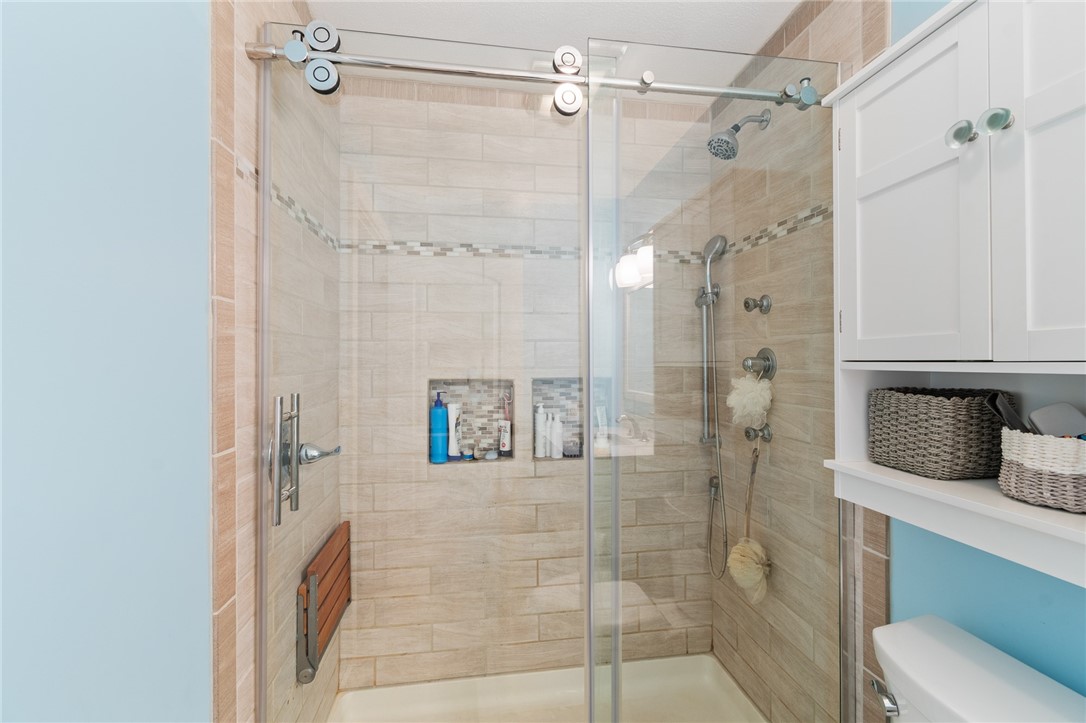 7733 East Port Bay Road Wolcott, NY 14590 - Photo 41 of 49 Custom tile in this primary suite FULL BATH