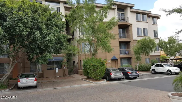 a view of a car parked in front of a building
