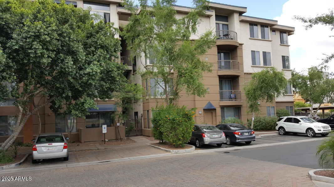 1701 East Colter Street, Unit 153 Phoenix, AZ 85016 - Photo 11 of 11 a view of a car parked in front of a building