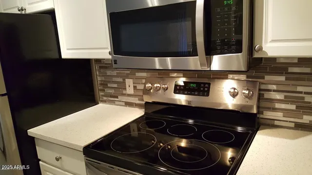 a kitchen with a stove and a microwave