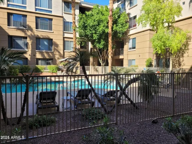 a view of a chair and table in the patio