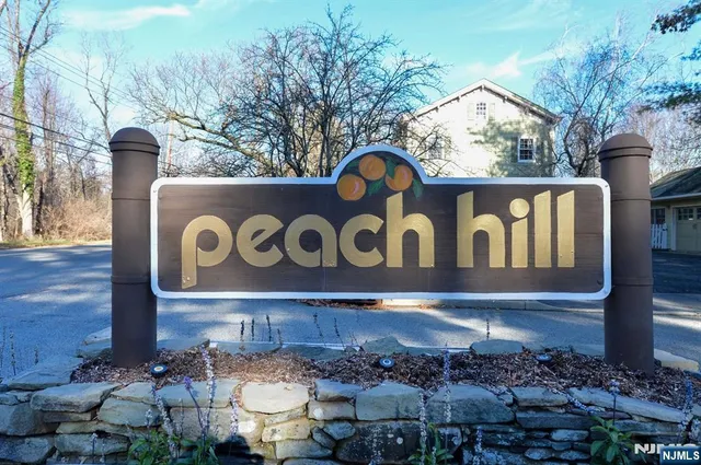 a sign that is on a brick wall