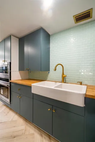 a bathroom with a sink and mirror