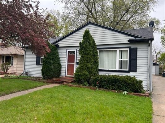 1512 Barton Boulevard Rockford, IL 61103 - Photo 1 of 10 a view of backyard with potted plants and a large tree
