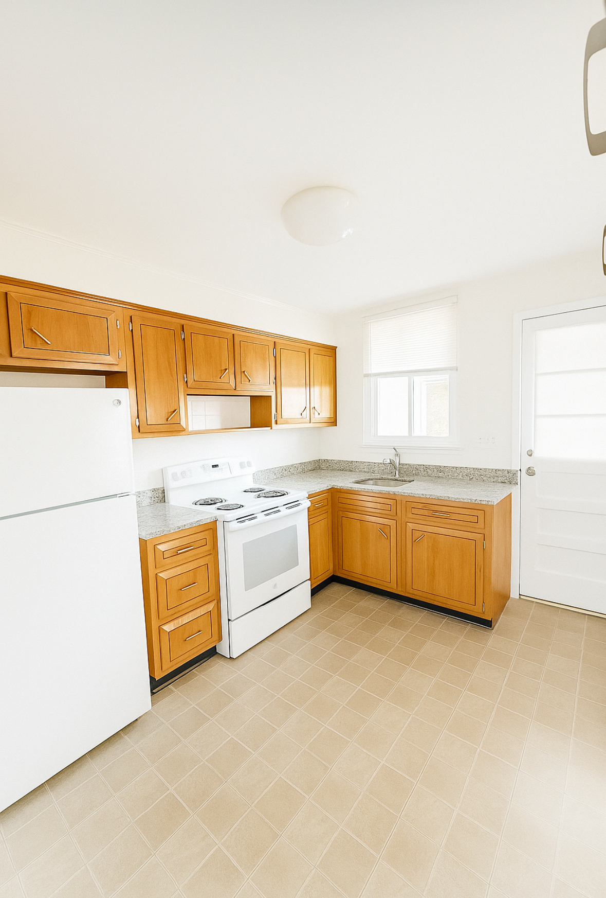 a kitchen with stainless steel appliances a sink and a refrigerator