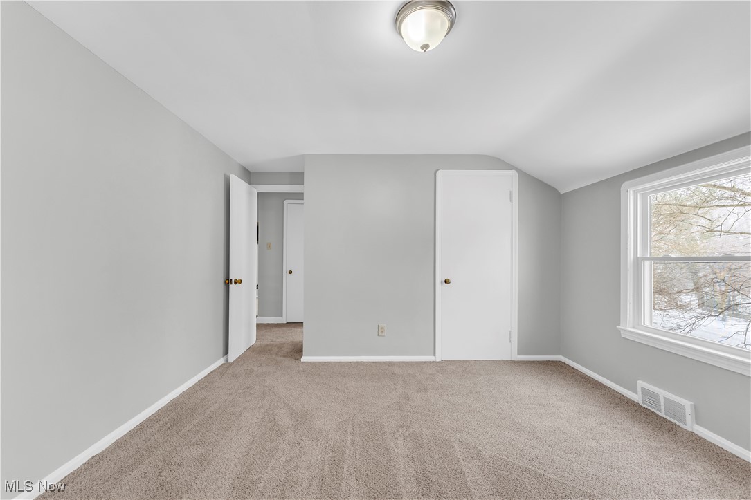 4693 Liberty Road South Euclid, OH 44121 - Photo 23 of 33 Unfurnished bedroom with carpet flooring and lofted ceiling