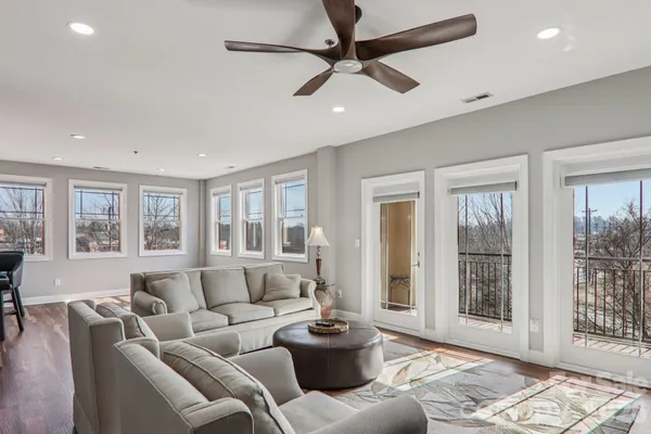 a living room with furniture and windows