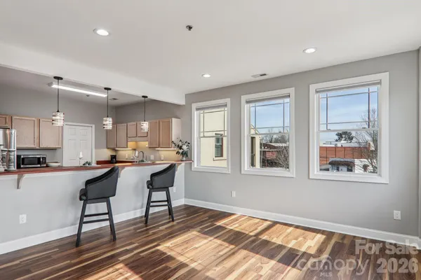a kitchen with stainless steel appliances granite countertop a refrigerator and microwave