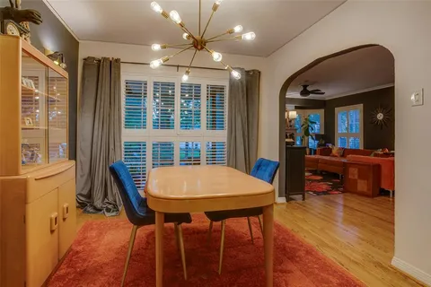 a living room with furniture rug and wooden floor