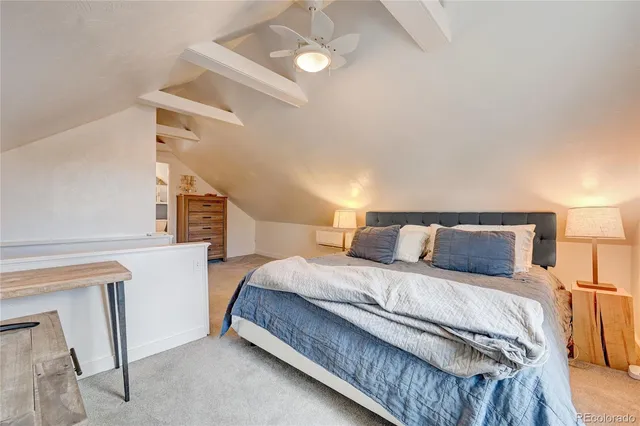 a bedroom with a bed and a cabinets