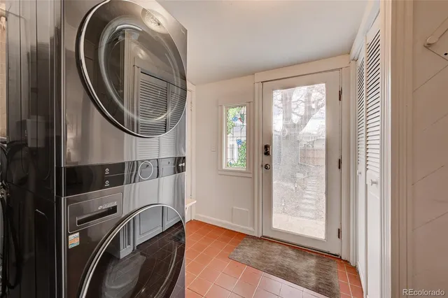 a view of a hallway with washer and dryer
