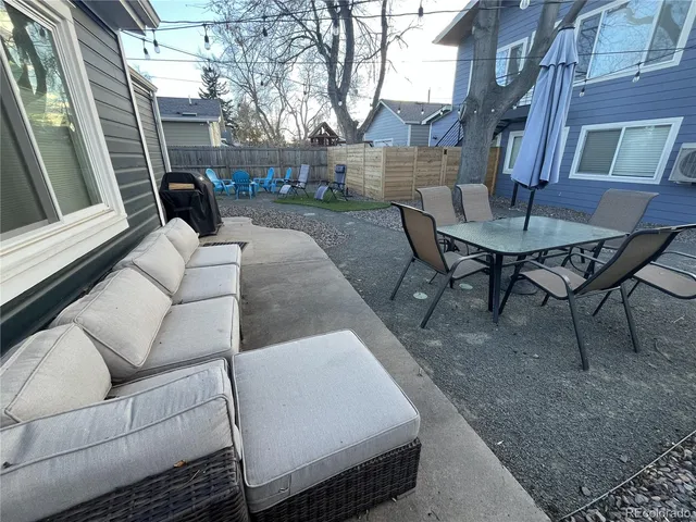 a view of a patio with couches table and chairs