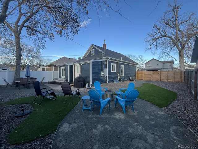 a view of a house with a yard porch and sitting area