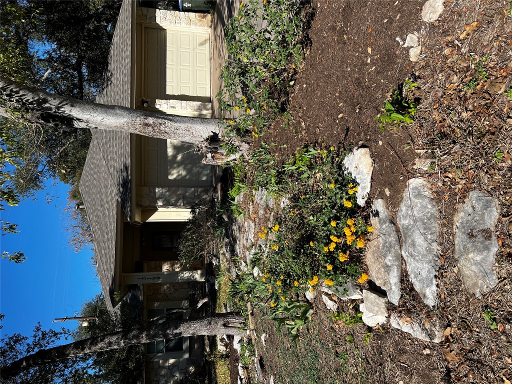 13169 Mill Stone Drive Austin, TX 78717 - Photo 1 of 8 a front view of a house with a yard