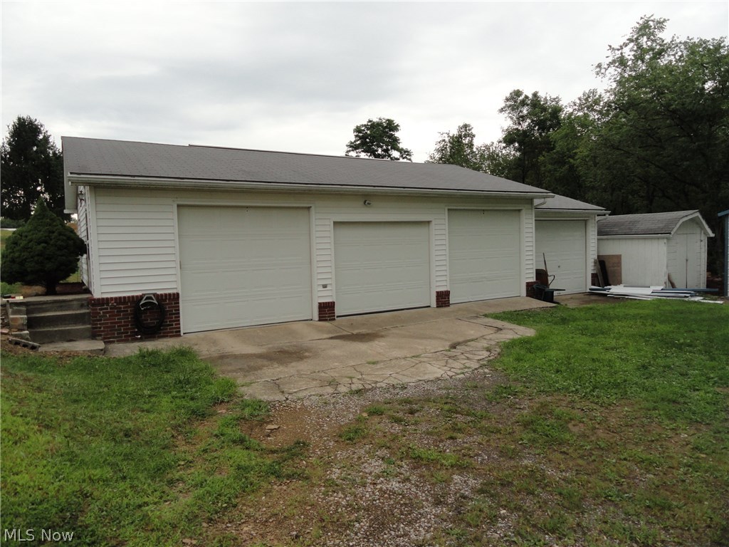 141 Arner Road Chester, WV 26034 - Photo 21 of 26 48 x 24 detached 4 car garage + 10 x 14 storage building