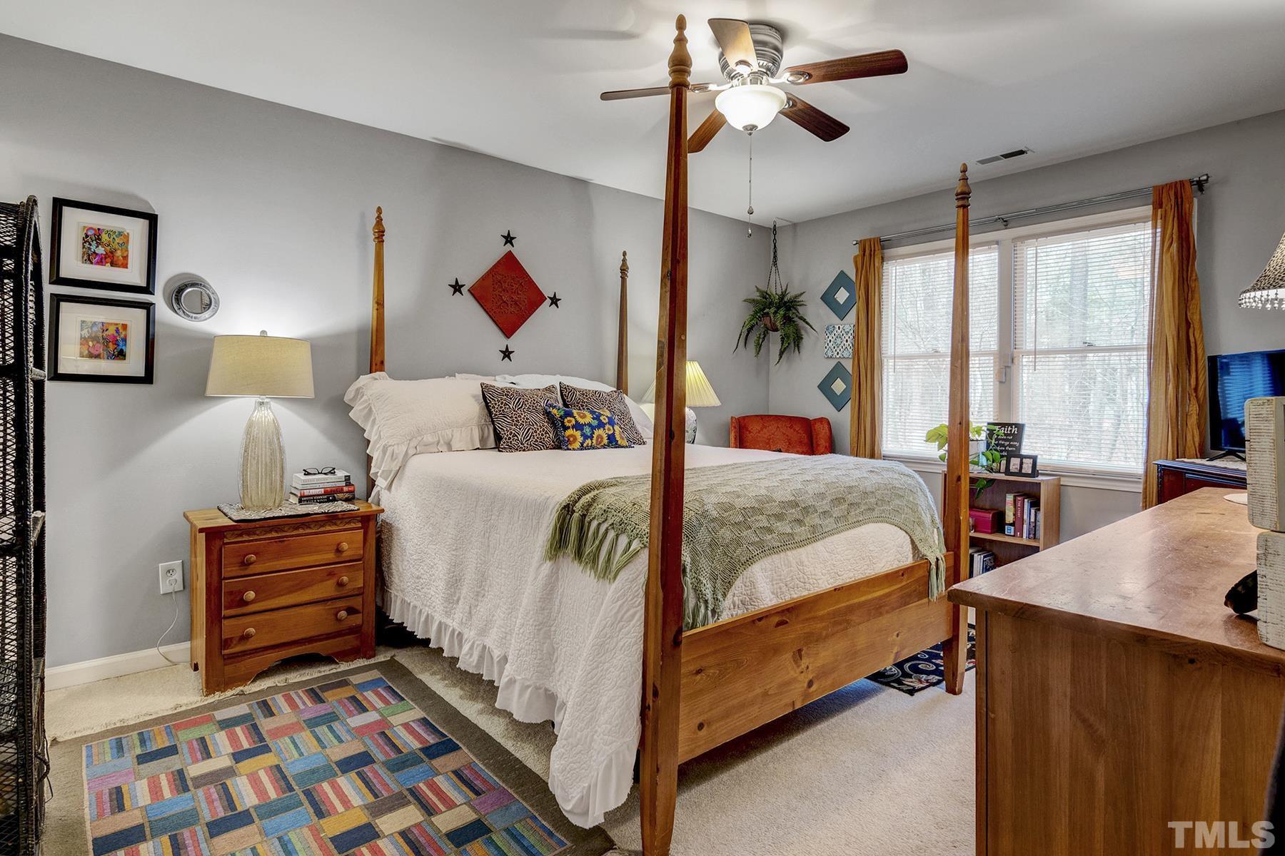 27 Sunflower Court Durham, NC 27713 - Photo 11 of 18 a bedroom with bed and a window