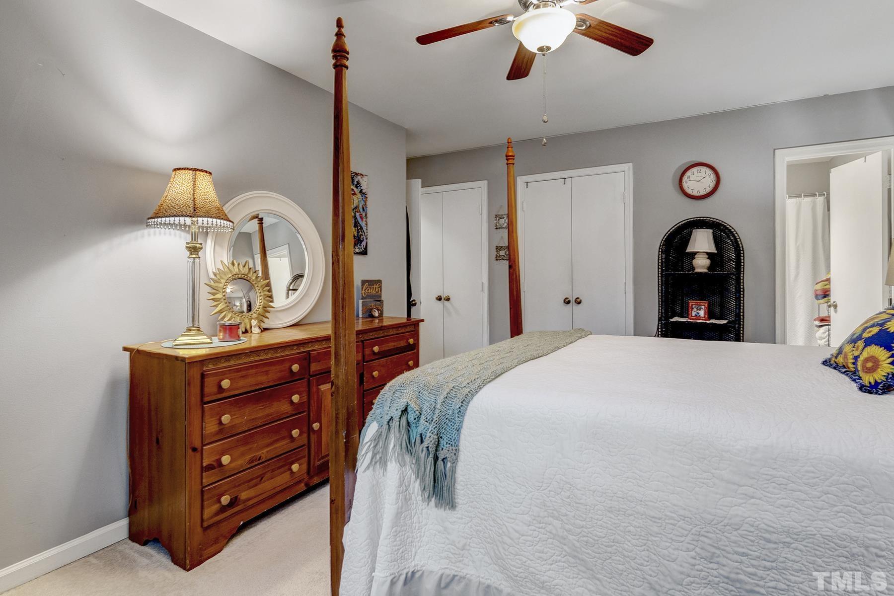 27 Sunflower Court Durham, NC 27713 - Photo 12 of 18 a bedroom with a bed and a dresser