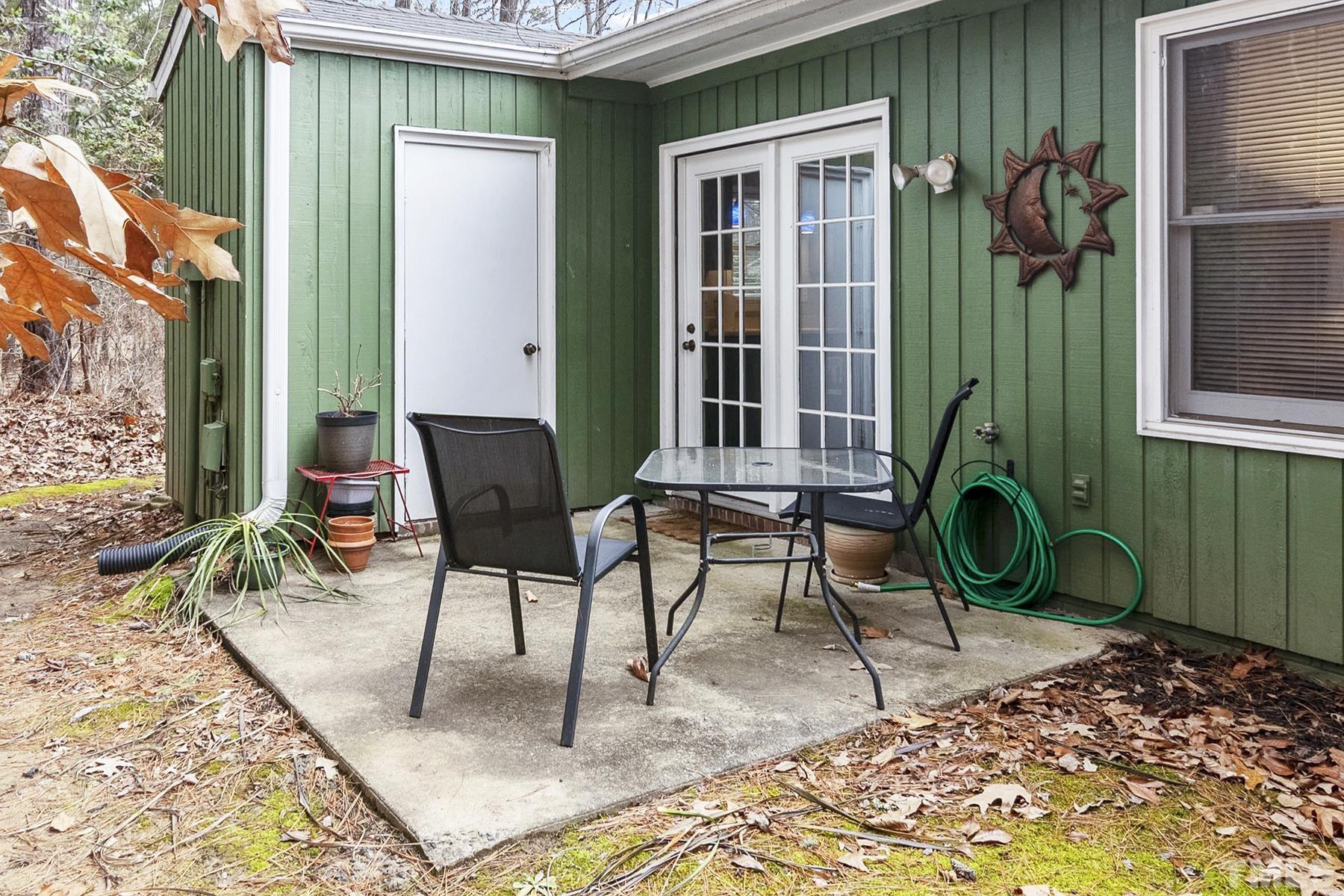 27 Sunflower Court Durham, NC 27713 - Photo 18 of 18 a backyard of a house with seating space