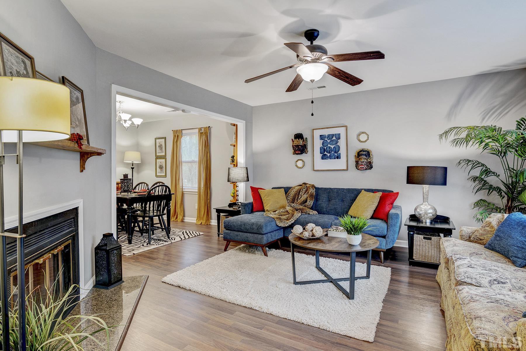27 Sunflower Court Durham, NC 27713 - Photo 4 of 18 a living room with furniture and a flat screen tv