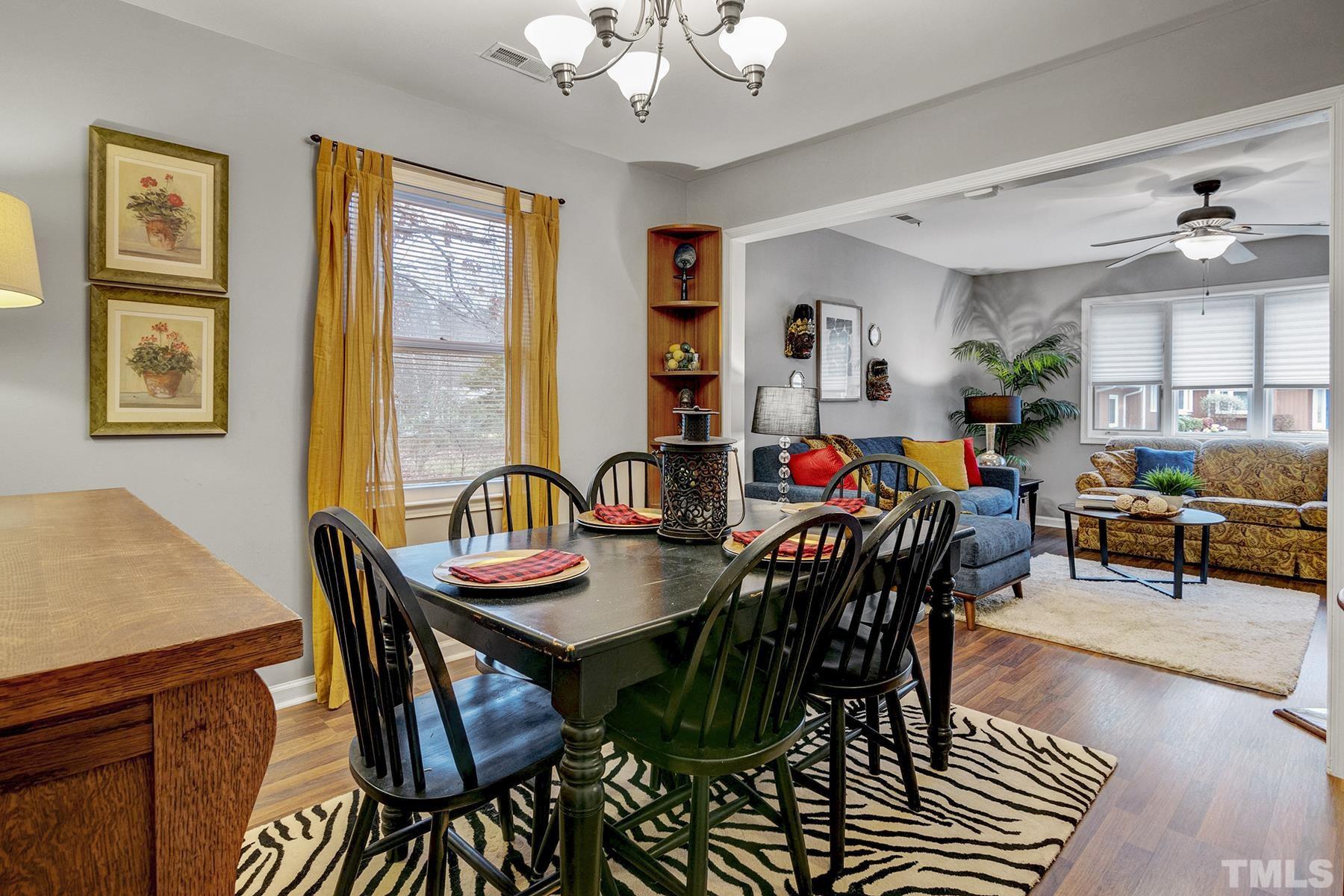 27 Sunflower Court Durham, NC 27713 - Photo 6 of 18 a view of a dining room with furniture window and wooden floor
