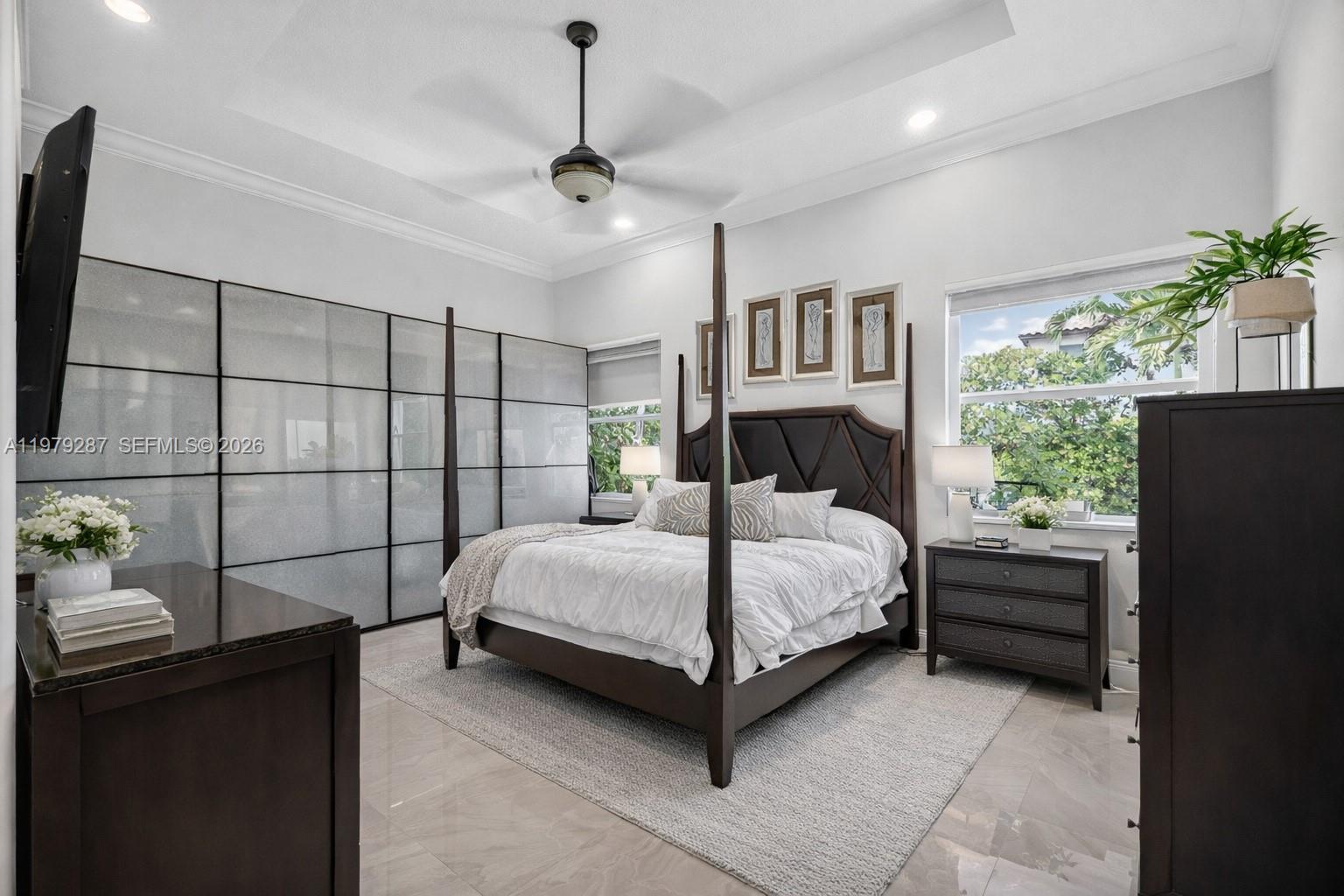 14929 Southwest 176th Terrace Miami, FL 33187 - Photo 12 of 40 a bedroom with a bed and a window