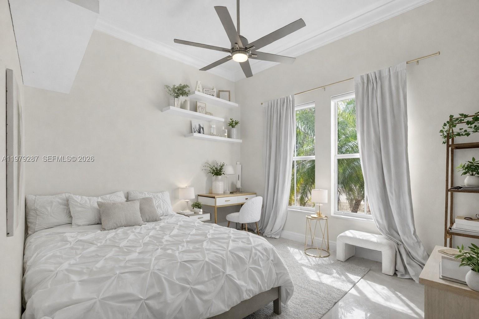 14929 Southwest 176th Terrace Miami, FL 33187 - Photo 22 of 40 a spacious bedroom with a bed and a large window