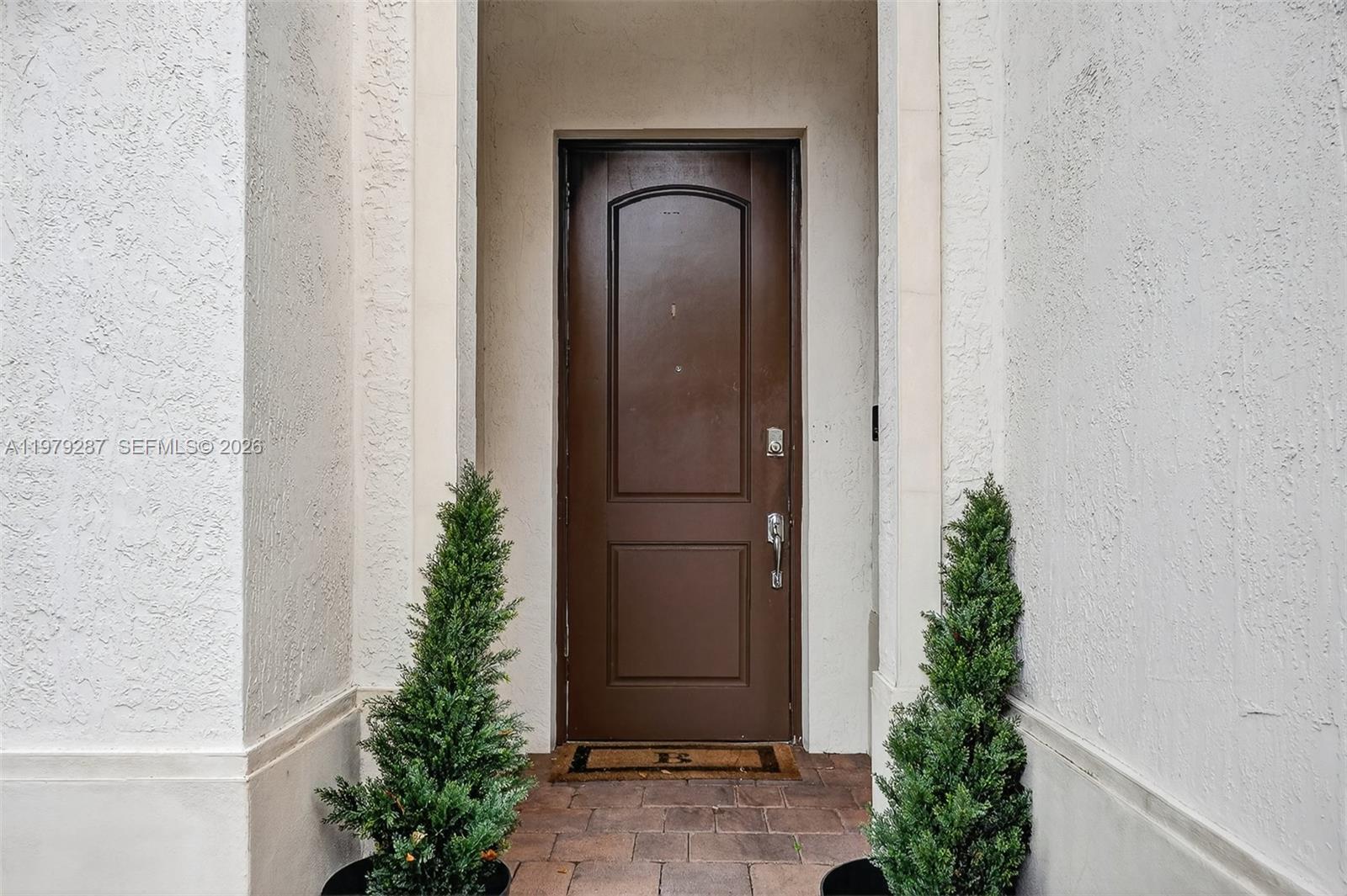 14929 Southwest 176th Terrace Miami, FL 33187 - Photo 37 of 40 an empty room with a potted plant and a window