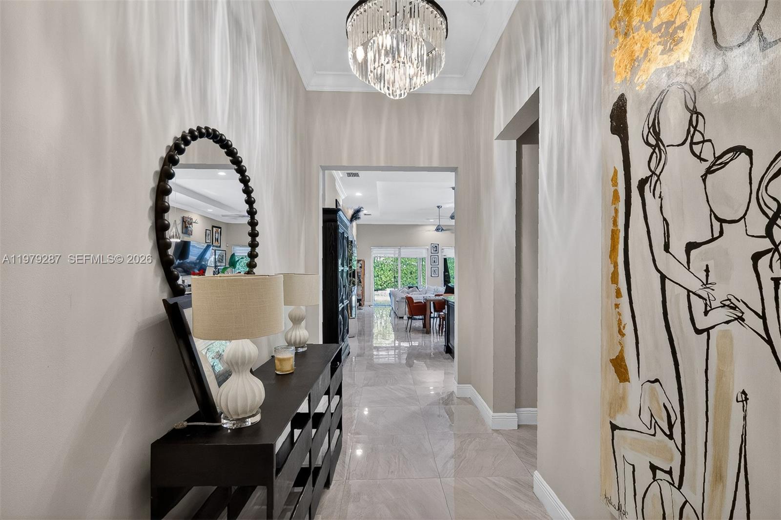 14929 Southwest 176th Terrace Miami, FL 33187 - Photo 5 of 40 a view of a dining room with furniture and chandelier
