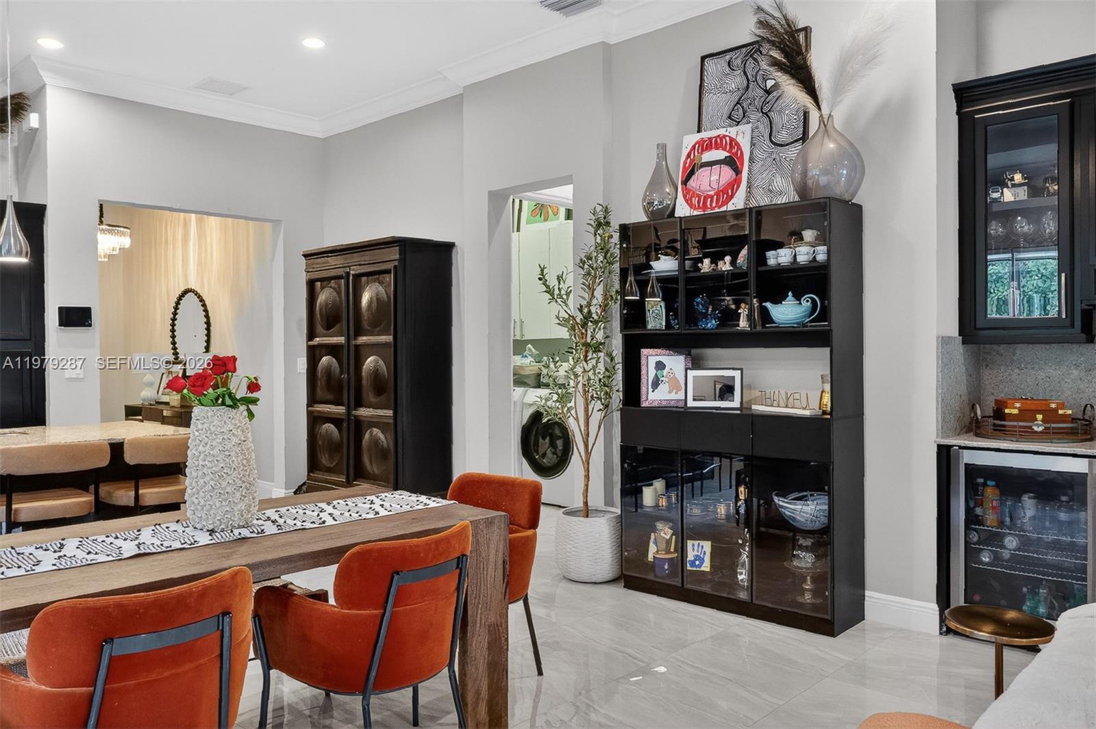 14929 Southwest 176th Terrace Miami, FL 33187 - Photo 8 of 40 a table and chairs in a kitchen