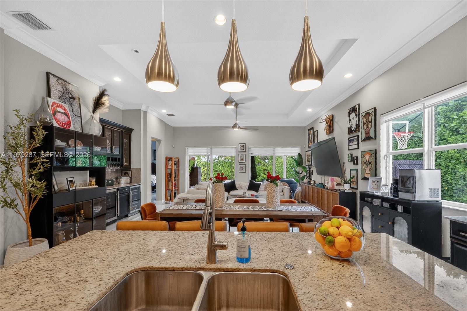 14929 Southwest 176th Terrace Miami, FL 33187 - Photo 10 of 40 a kitchen with stainless steel appliances granite countertop a sink counter space cabinets and furniture