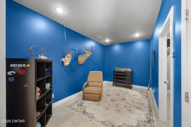 a bedroom with a bed and a television