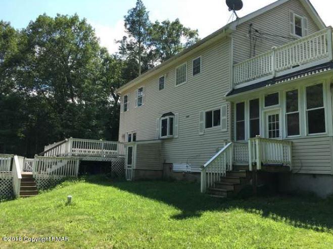 1090 Milford Road Dingmans Ferry, PA 18328 - Photo 2 of 13 a view of house with backyard