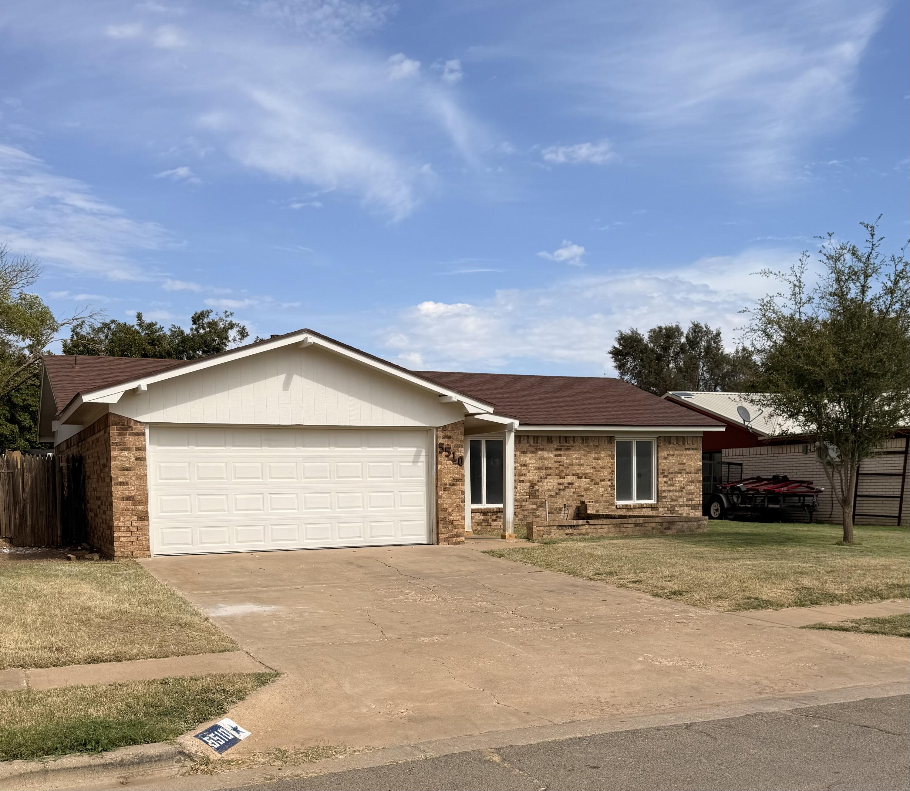 5510 Amherst Street Lubbock, TX 79416 - Photo 2 of 21 a front view of a house with a garden
