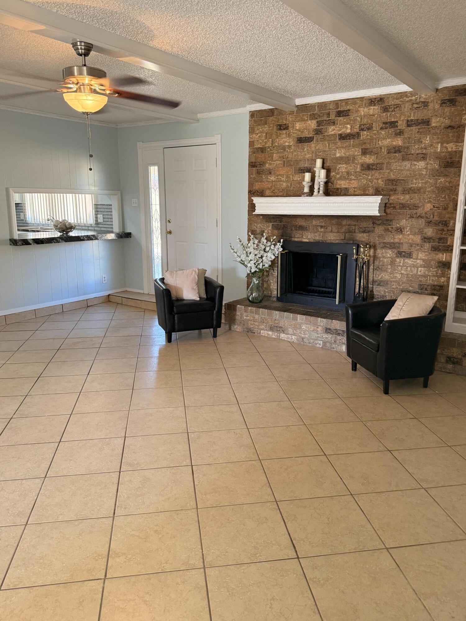 5510 Amherst Street Lubbock, TX 79416 - Photo 5 of 21 a view of a livingroom with furniture and a fireplace