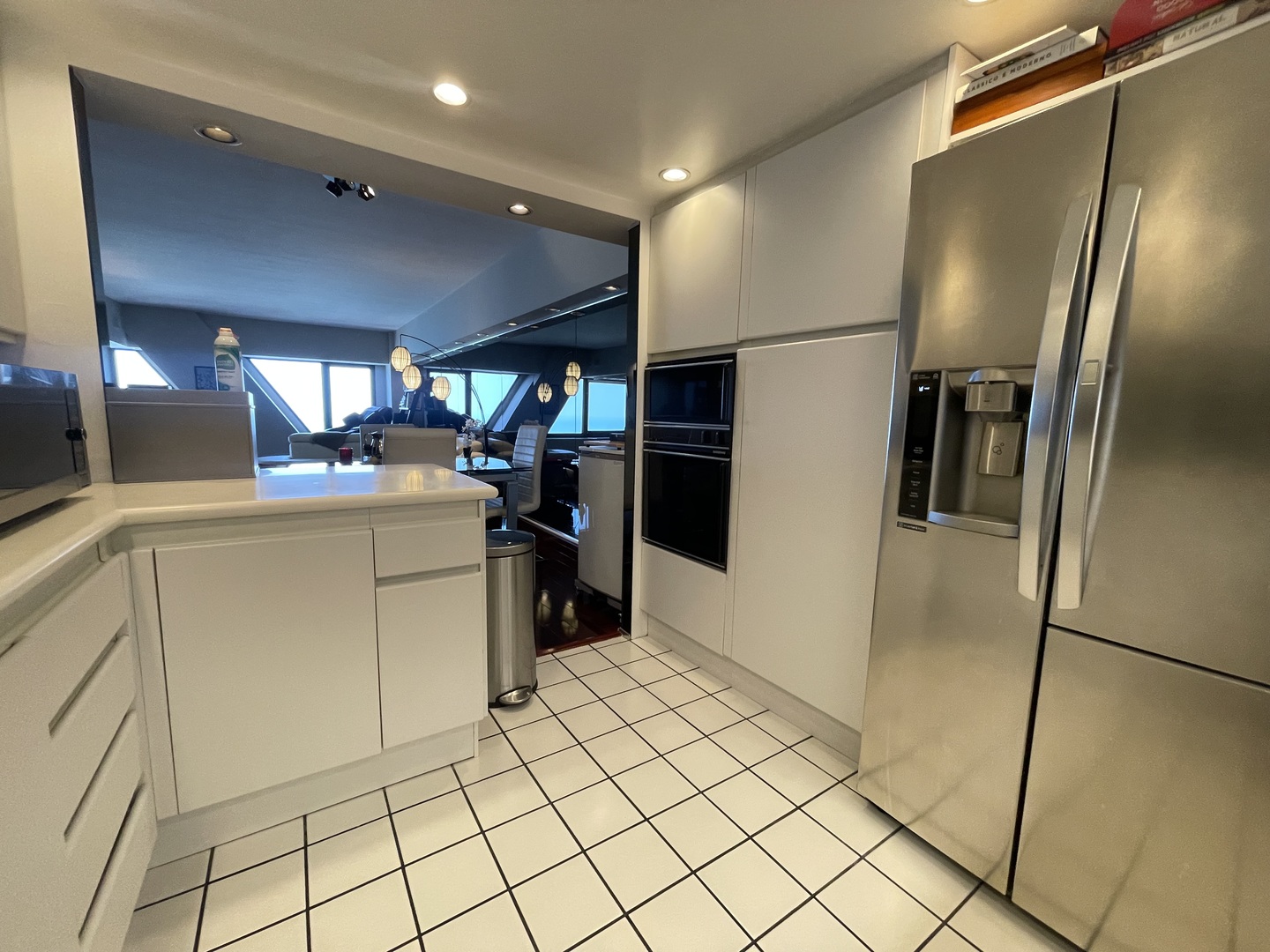 175 East Delaware Place, Unit 6706 Chicago, IL 60611 - Photo 12 of 30 a kitchen with stainless steel appliances a refrigerator sink and microwave