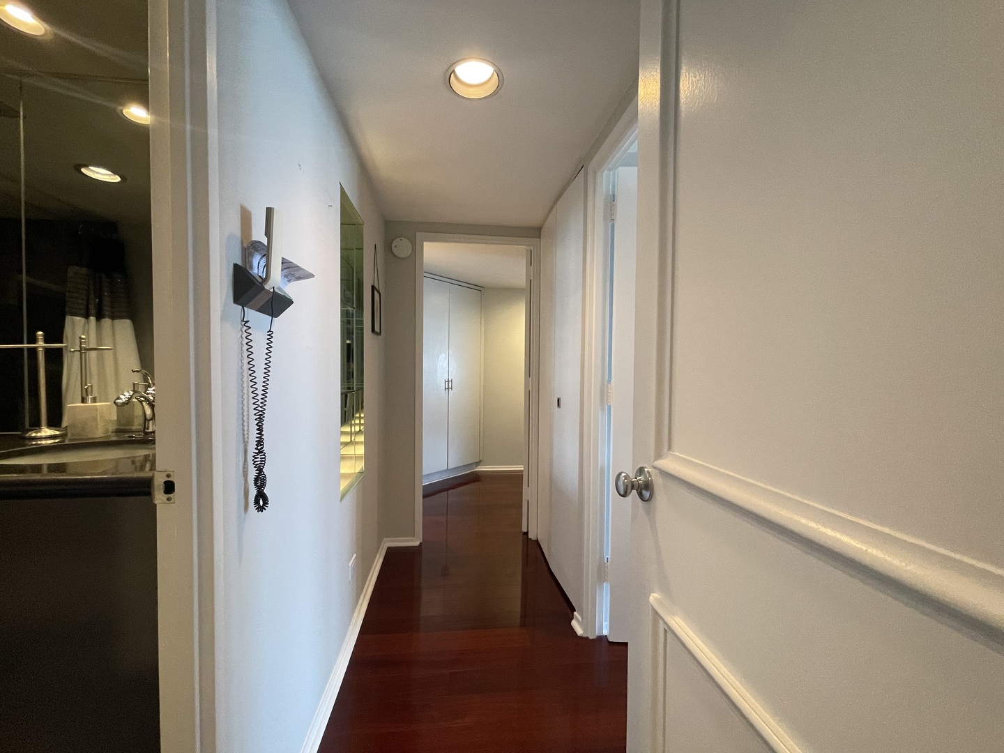 175 East Delaware Place, Unit 6706 Chicago, IL 60611 - Photo 17 of 30 a view of a hallway with wooden floor and staircase
