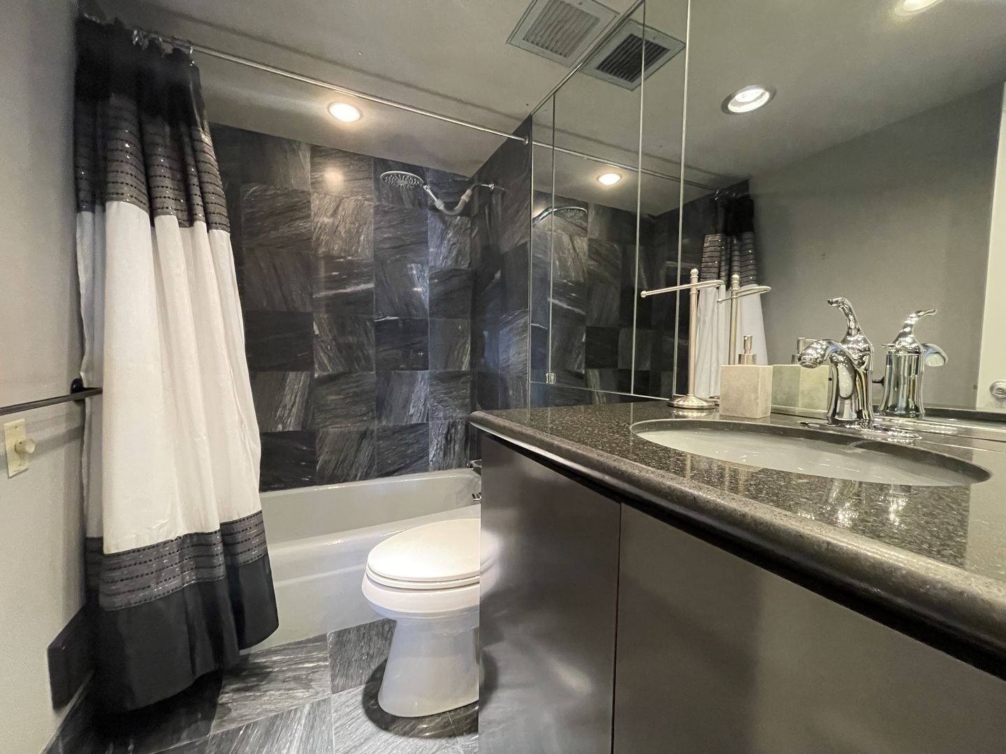 175 East Delaware Place, Unit 6706 Chicago, IL 60611 - Photo 18 of 30 a bathroom with a sink a toilet and shower