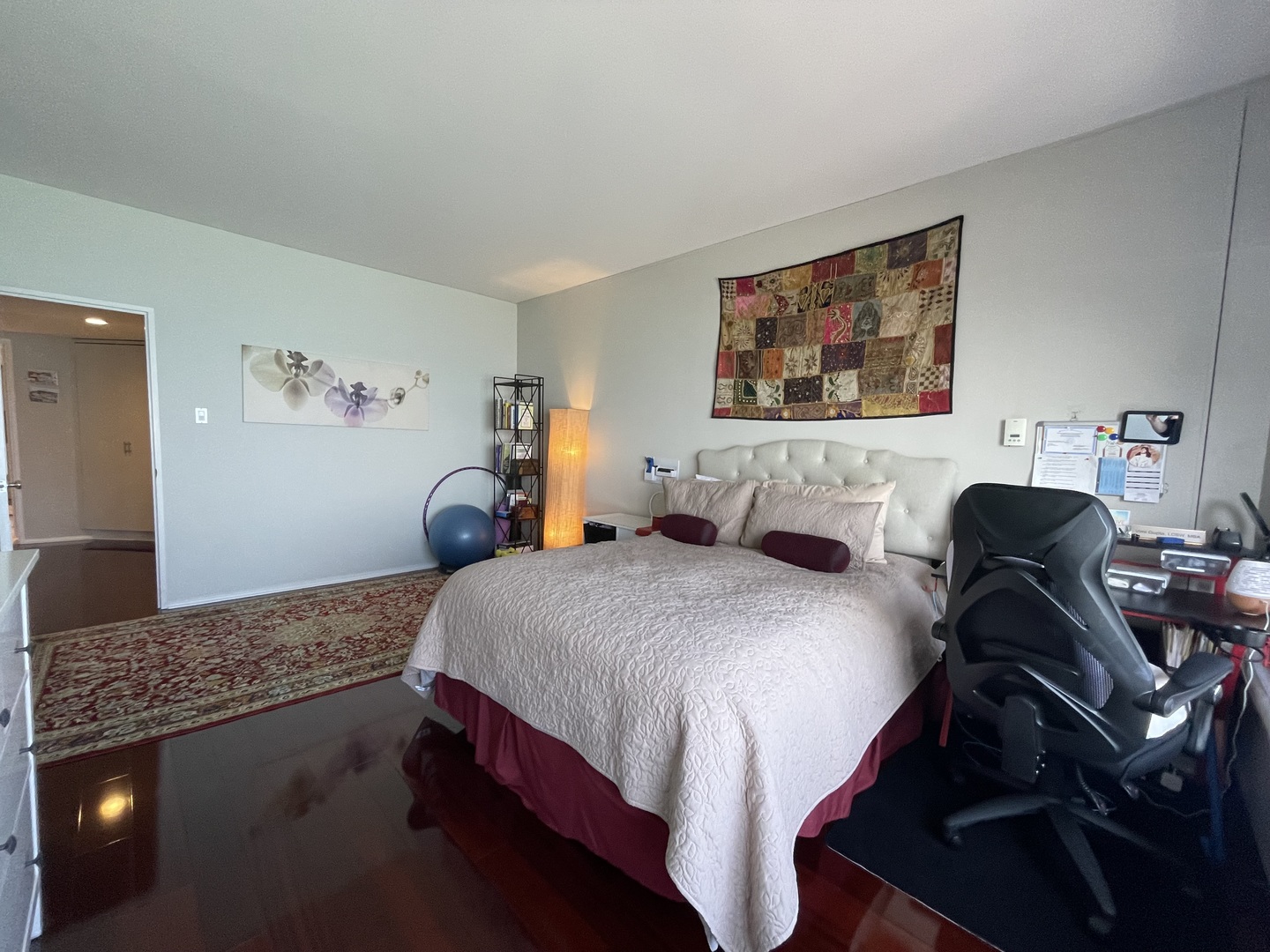 175 East Delaware Place, Unit 6706 Chicago, IL 60611 - Photo 23 of 30 a bedroom with a bed and dresser