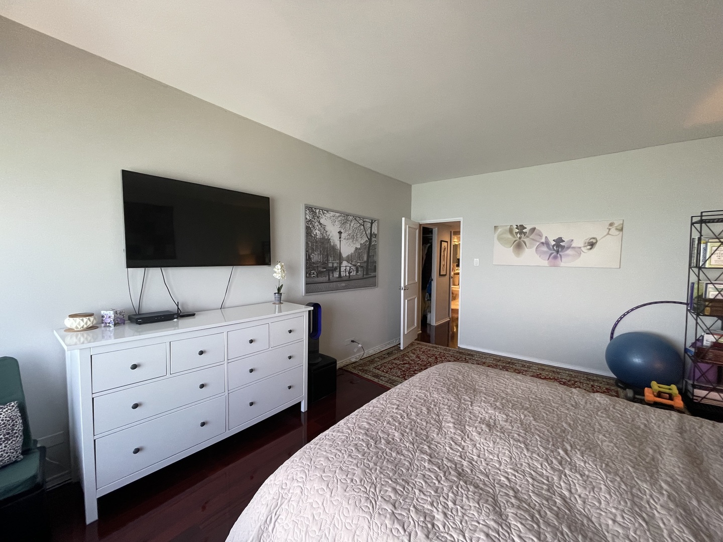 175 East Delaware Place, Unit 6706 Chicago, IL 60611 - Photo 24 of 30 a bedroom with a bed and a flat screen tv in it
