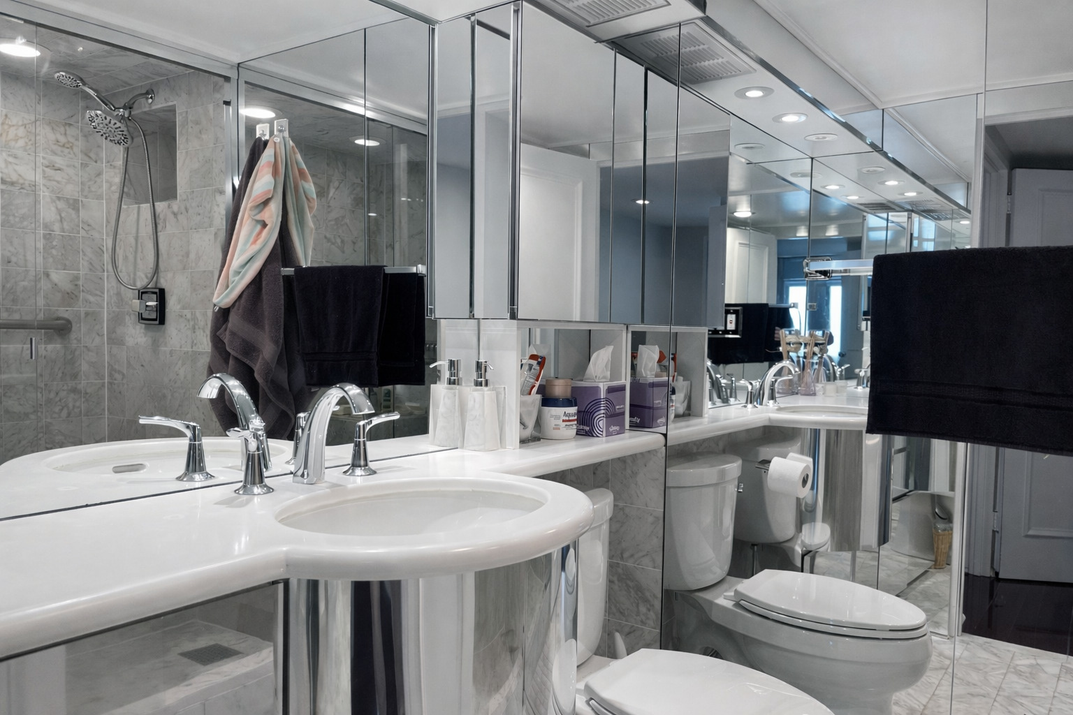 175 East Delaware Place, Unit 6706 Chicago, IL 60611 - Photo 26 of 30 a bathroom with a sink a toilet and a mirror