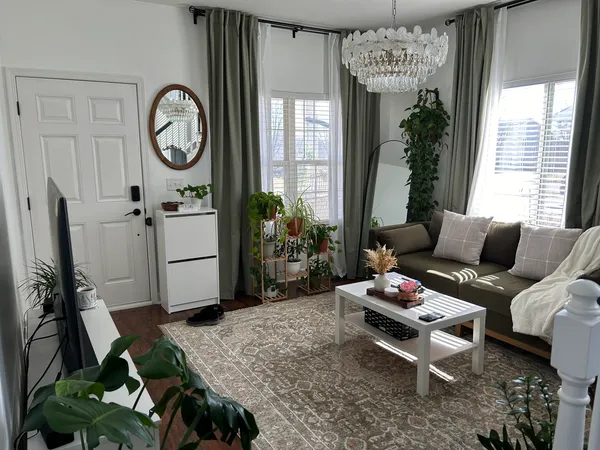 a living room with furniture and a large window