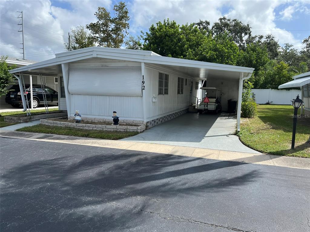 1040 Main Street, Unit 192 Dunedin, FL 34698 - Photo 2 of 15 a view of a back yard of the house