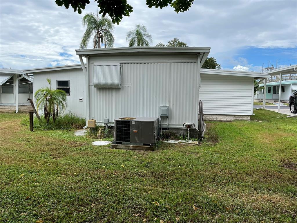 1040 Main Street, Unit 192 Dunedin, FL 34698 - Photo 3 of 15 a view of a backyard with a sitting area